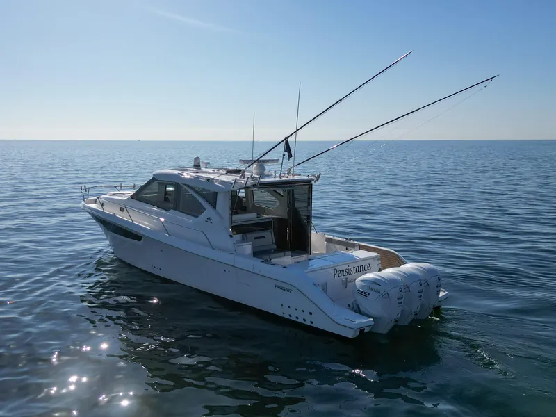 Slide: The Image of 2024 Pursuit OS 445 Offshore boat on calm ocean waters. - 22