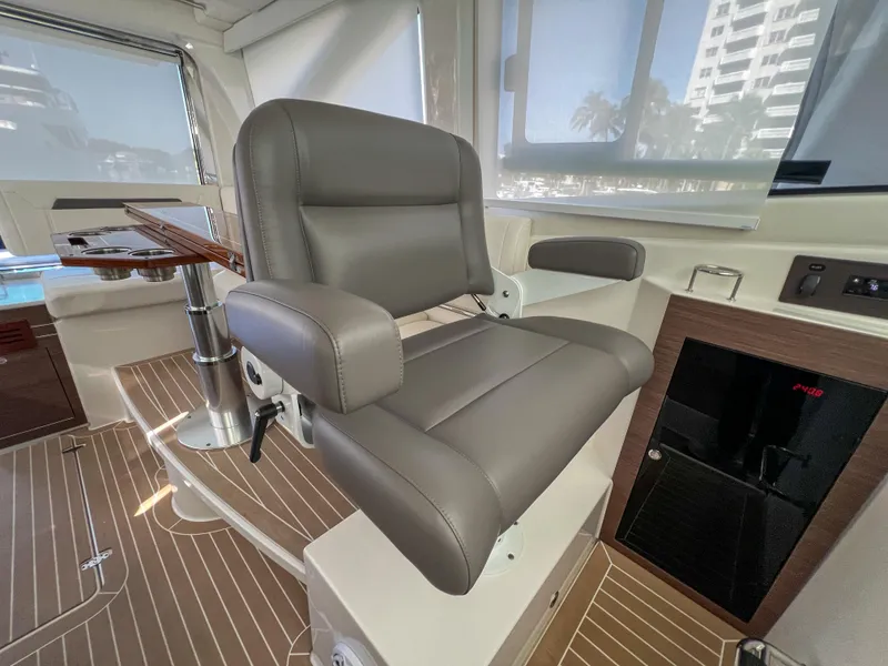 Slide: The Image of 2024 Pursuit OS 445 Offshore interior with luxurious seating and modern design. - 48
