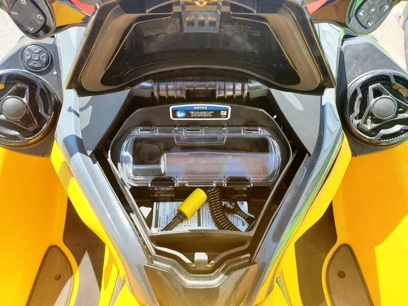 Slide: The Image of 2021 Sea-Doo RXT storage compartment with waterproof container and safety equipment. - 4