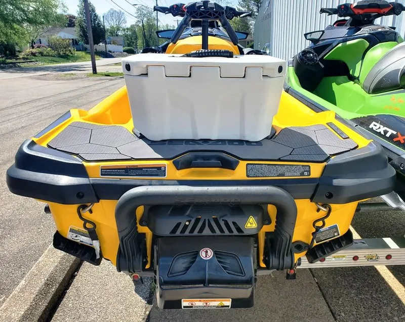 Slide: The Image of 2021 Sea-Doo RXT yellow jet ski with storage box on trailer. - 8