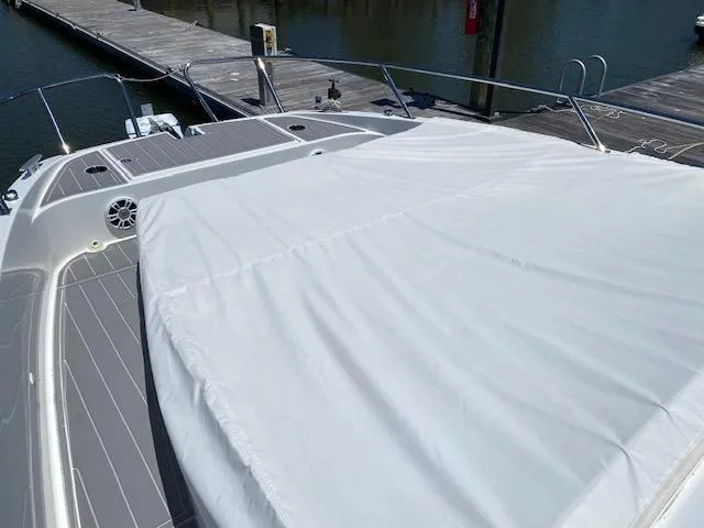 Slide: The Image of 2024 Beneteau Gran Turismo 32 yacht with covered deck at marina. - 10