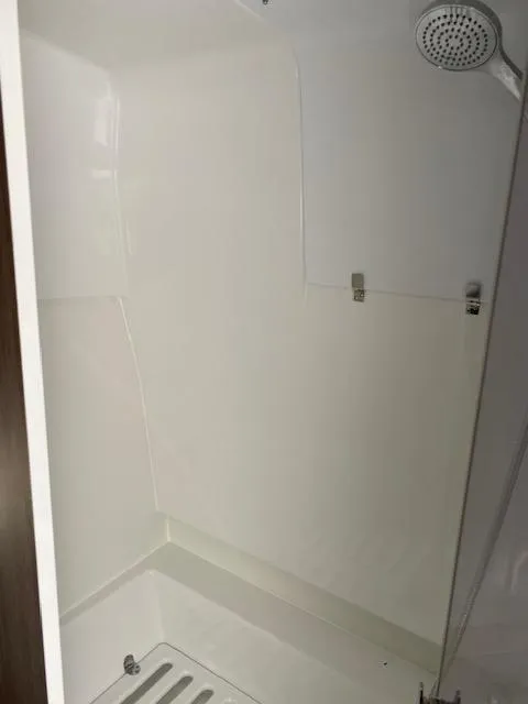 Slide: The Image of Shower area in 2024 Beneteau Gran Turismo 32 yacht, featuring modern fixtures. - 15