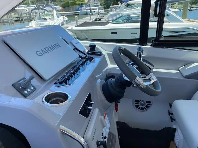Slide: The Image of 2024 Beneteau Gran Turismo 32 helm with Garmin navigation system. - 4