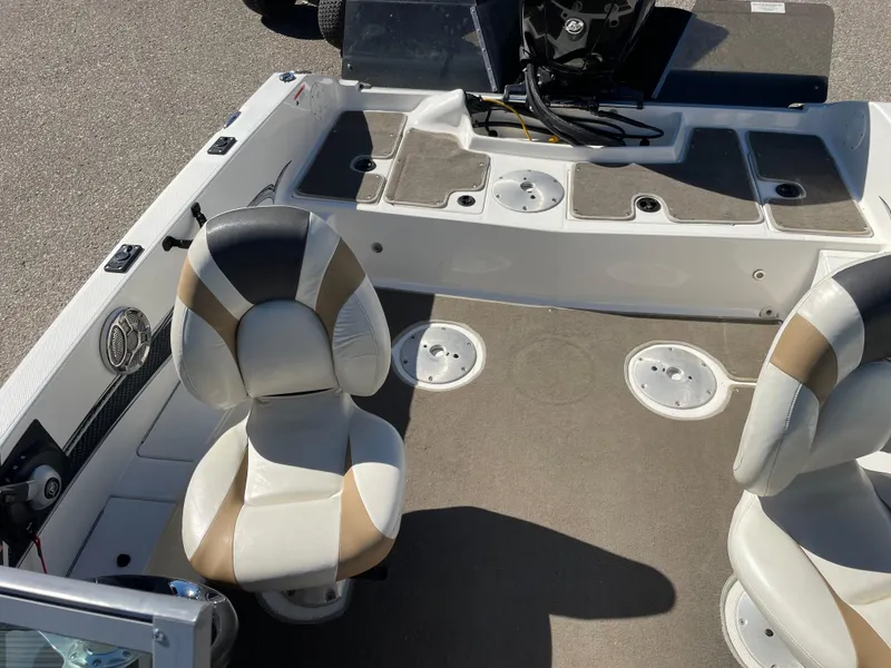 Slide: The Image of 2012 Larson FX 1750 DC boat interior with seating and storage compartments. - 5