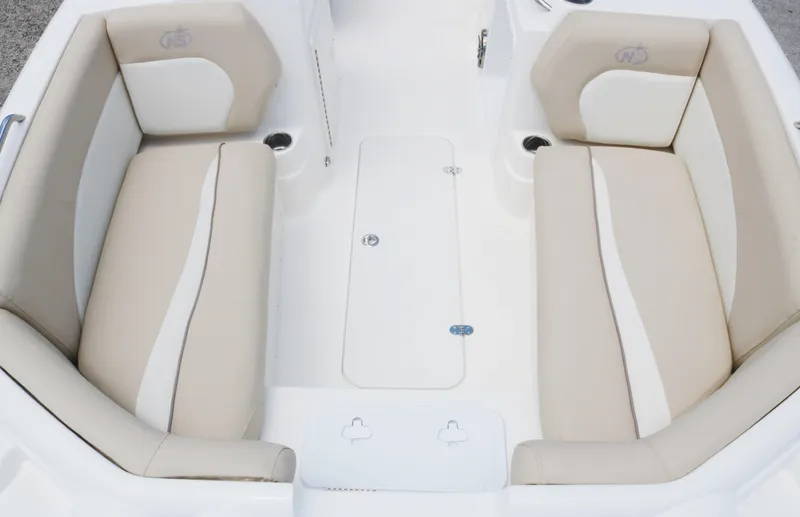 Slide: The Image of 2018 NauticStar 203 SC boat interior with beige and white seating. - 11