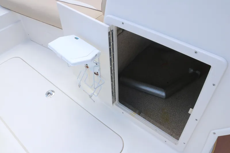 Slide: The Image of 2018 NauticStar 203 SC boat storage compartment with open hatch. - 13