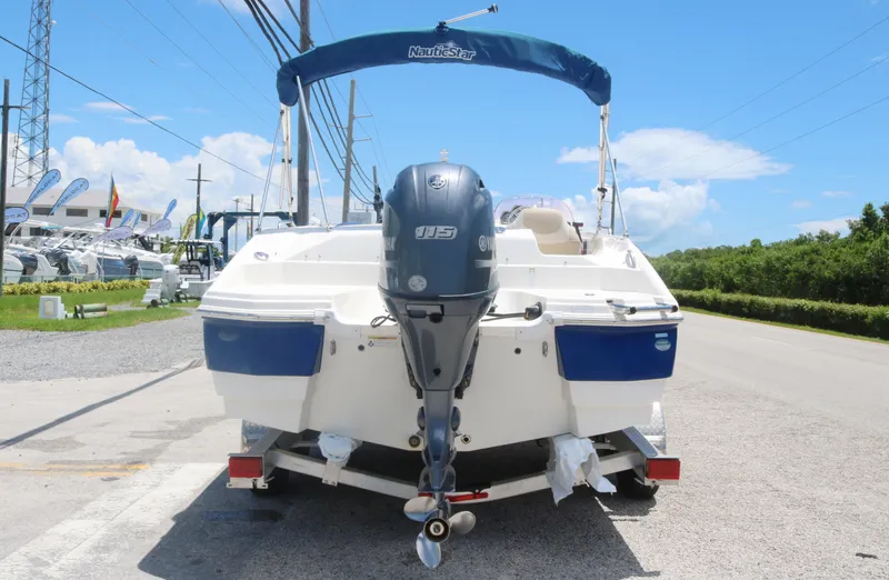 Slide: The Image of 2018 NauticStar 203 SC boat with Yamaha outboard motor on trailer. - 4
