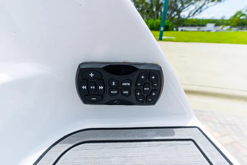 Slide: The Image of Yamaha Boats 252S 2021 audio control panel with various function buttons. - 18