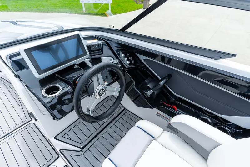 Slide: The Image of 2021 Yamaha Boats 252S cockpit with modern dashboard and steering wheel. - 32