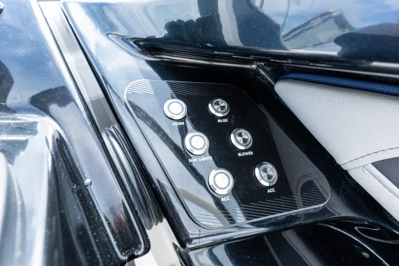 Slide: The Image of Control panel of 2021 Yamaha Boats 252S with various switches. - 33