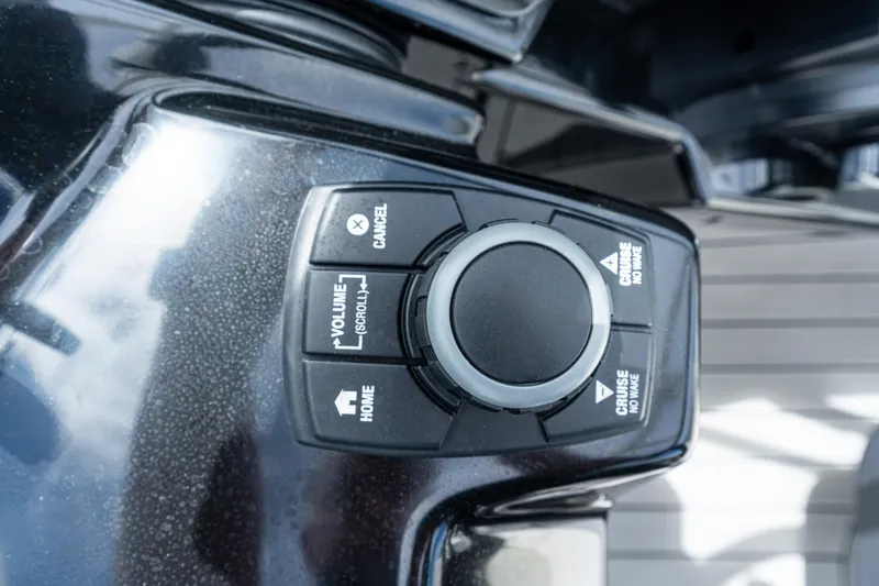 Slide: The Image of Control panel of 2021 Yamaha Boats 252S with navigation and volume buttons. - 34