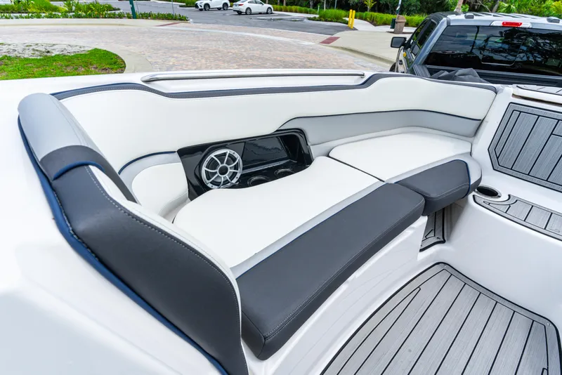 Slide: The Image of 2021 Yamaha Boats 252S interior with sleek seating and built-in speaker. - 42