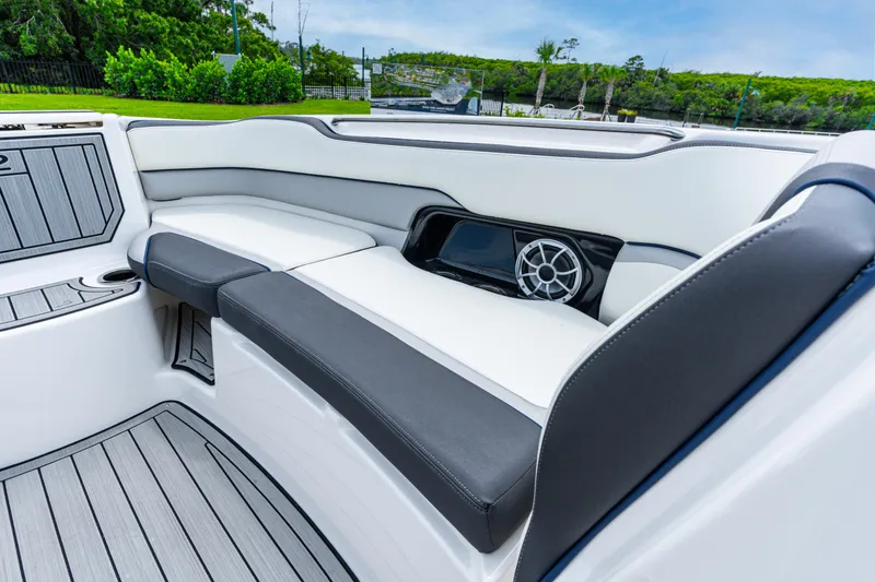 Slide: The Image of 2021 Yamaha Boats 252S interior with sleek seating and modern speaker system. - 43