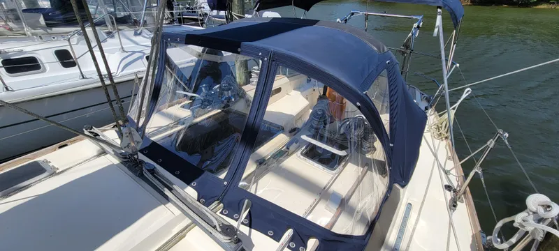 Slide: The Image of 1988 Sabre 38 MkII sailboat with blue canvas cockpit enclosure. - 11