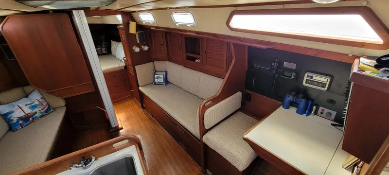 Slide: The Image of Interior of 1988 Sabre 38 MkII sailboat with wooden finish and cozy seating. - 17