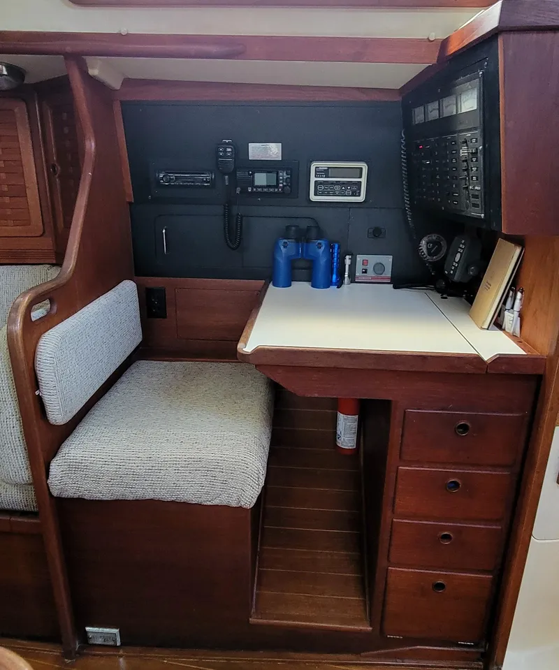 Slide: The Image of Navigation station inside a 1988 Sabre 38 MkII sailboat with communication equipment. - 22