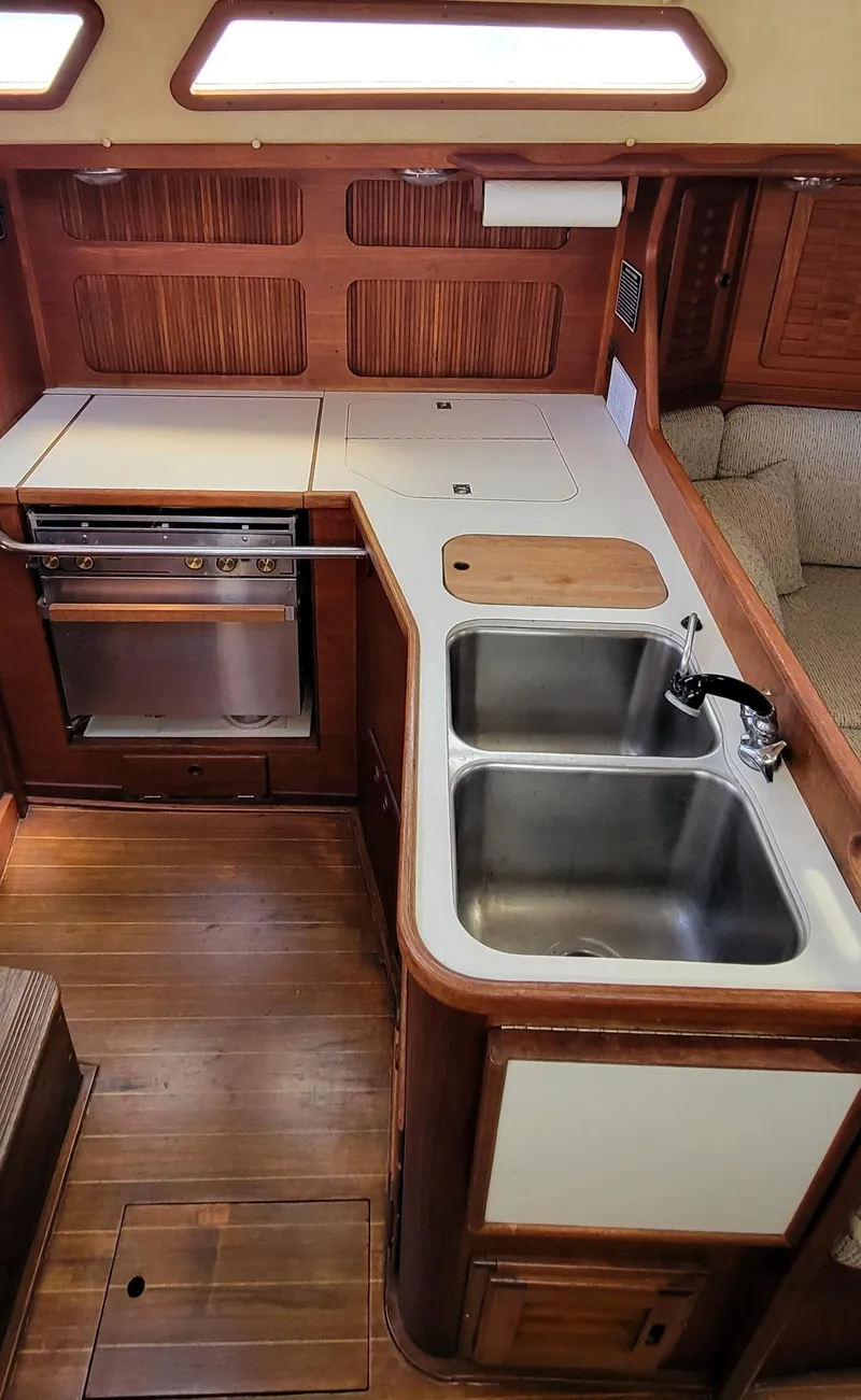 Slide: The Image of 1988 Sabre 38 MkII yacht galley with double sink and stove - 25