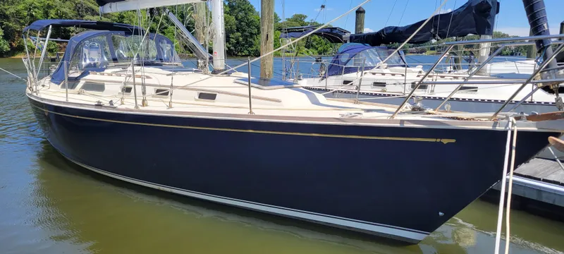 Slide: The Image of 1988 Sabre 38 MkII sailboat docked in a marina. - 3