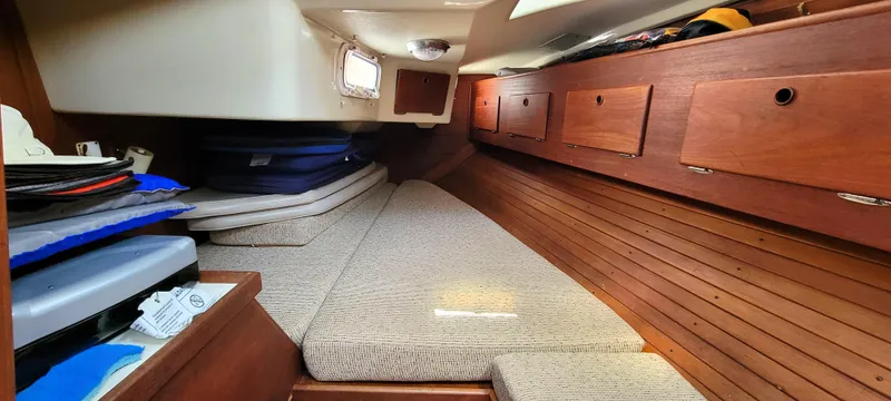 Slide: The Image of Interior cabin of 1988 Sabre 38 MkII sailboat with wooden storage cabinets. - 31