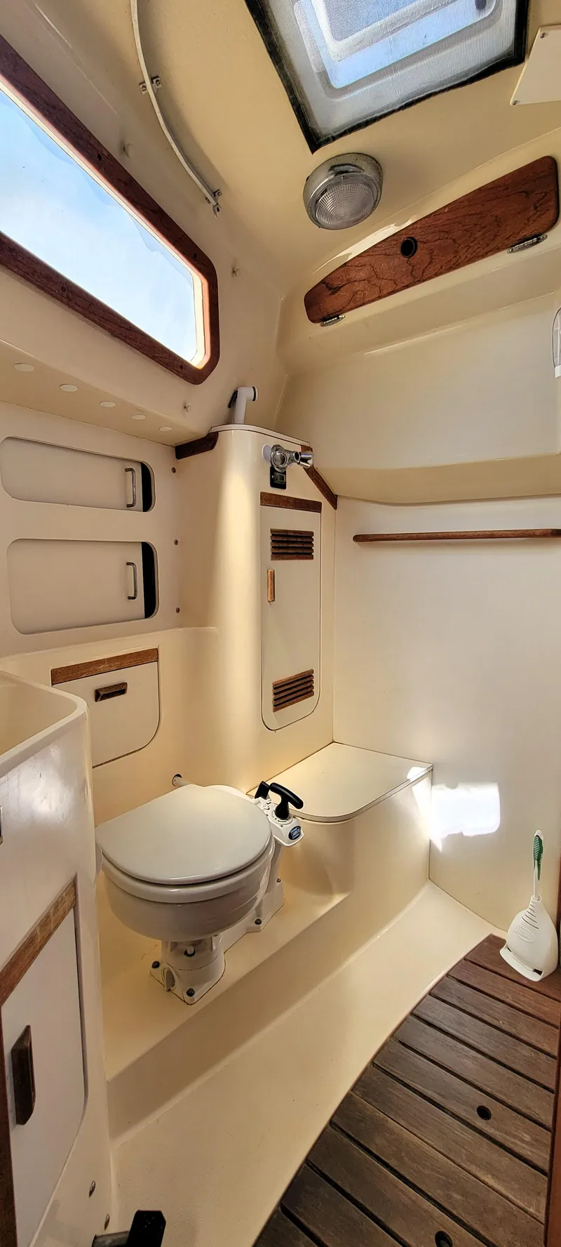 Slide: The Image of 1988 Sabre 38 MkII sailboat bathroom with skylight and wooden accents. - 32
