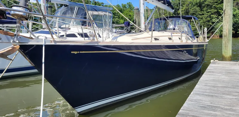 Slide: The Image of 1988 Sabre 38 MkII sailboat docked in a marina. - 4