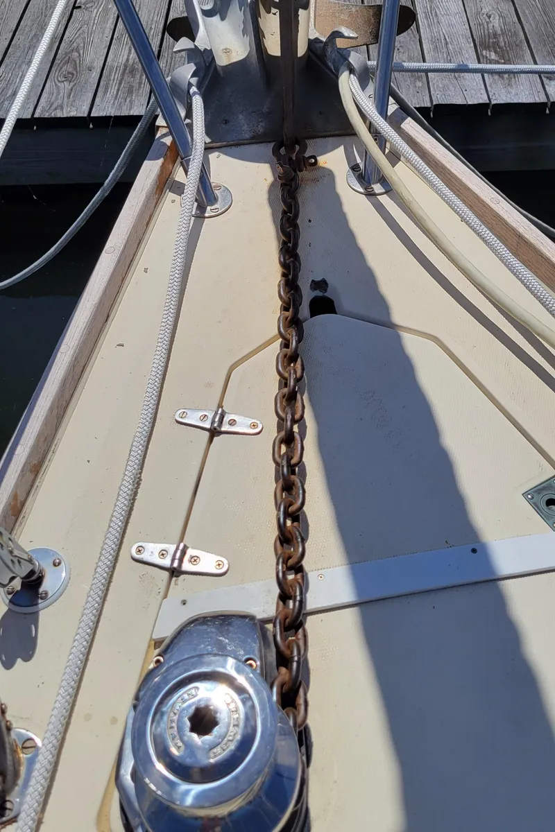 Slide: The Image of 1988 Sabre 38 MkII sailboat anchor chain and windlass on deck. - 6