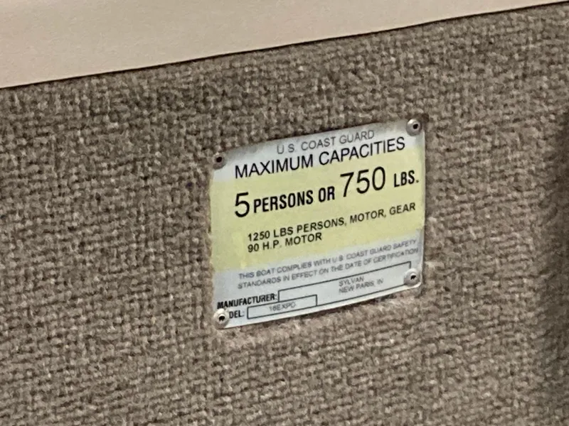 Slide: The Image of 2002 Sylvan 1600 Expedition DC boat capacity label, 5 persons or 750 lbs, 90 HP motor. - 10