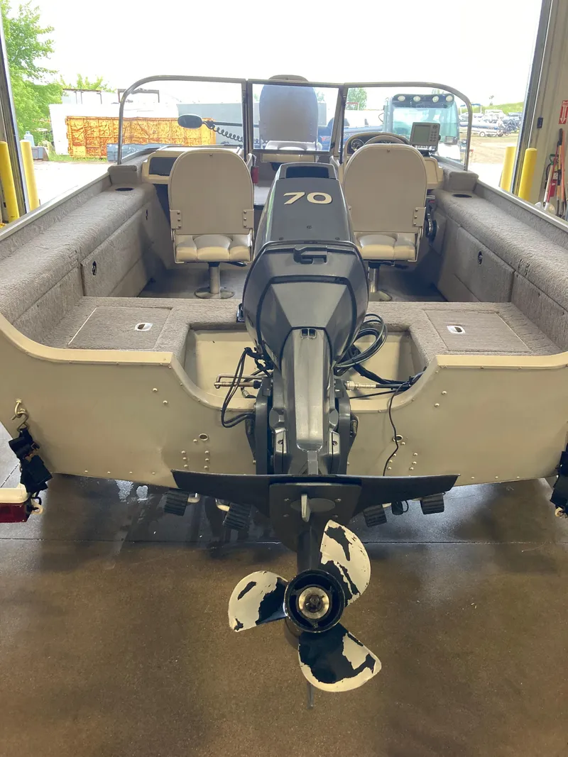 Slide: The Image of 2002 Sylvan 1600 Expedition DC boat with 70 HP outboard motor. - 12