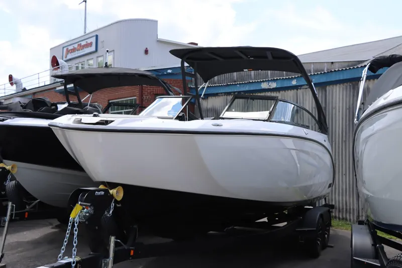 Slide: The Image of 2024 Yamaha Boats AR250 displayed at a marina. - 1