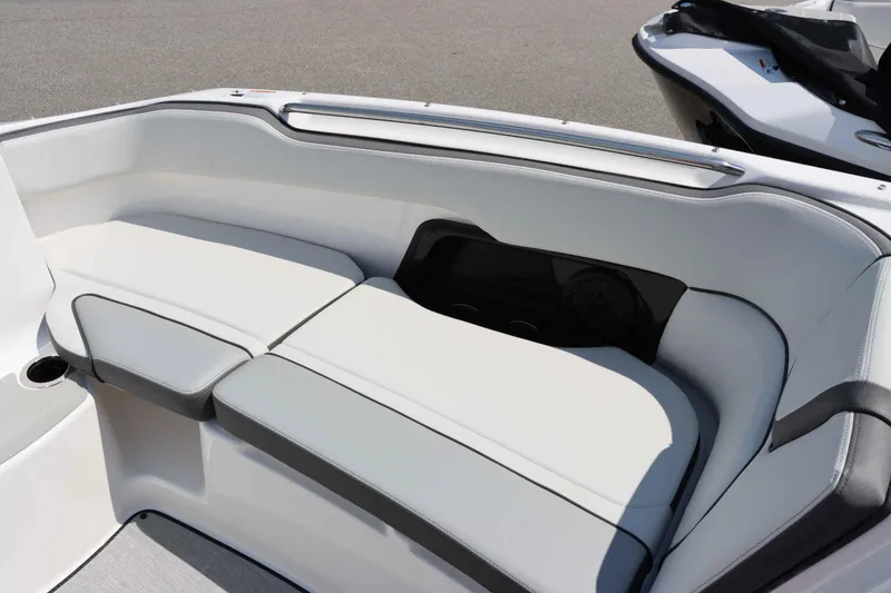 Slide: The Image of Interior seating of 2024 Yamaha Boats AR250, featuring white and gray cushioned seats. - 18