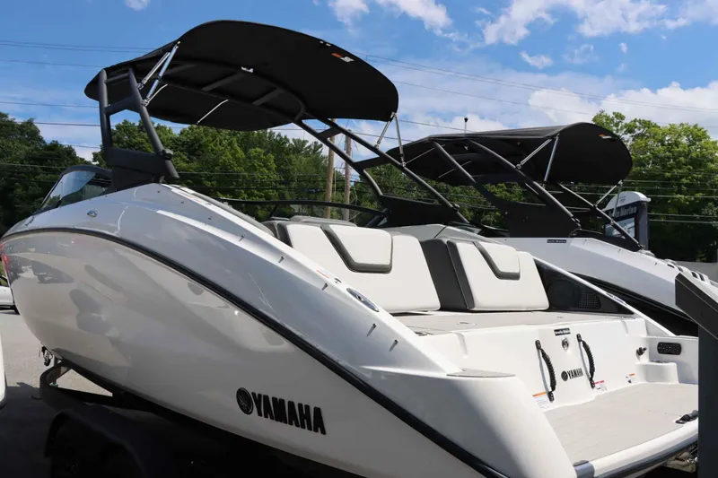 Slide: The Image of 2024 Yamaha Boats AR250 with black canopy, rear view. - 2