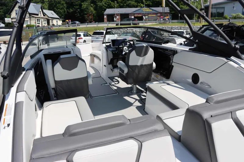 Slide: The Image of 2024 Yamaha Boats AR250 interior with seating and steering console. - 4
