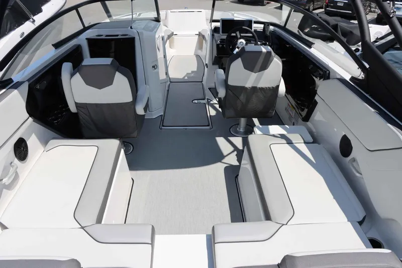 Slide: The Image of Interior of 2024 Yamaha Boats AR250, featuring modern seating and steering console. - 5