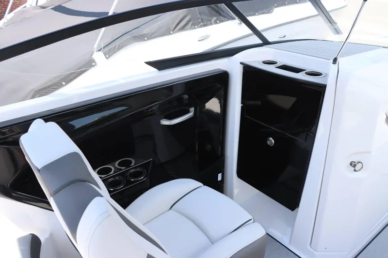 Slide: The Image of Interior of 2024 Yamaha Boats AR250, featuring sleek seating and cup holders. - 8