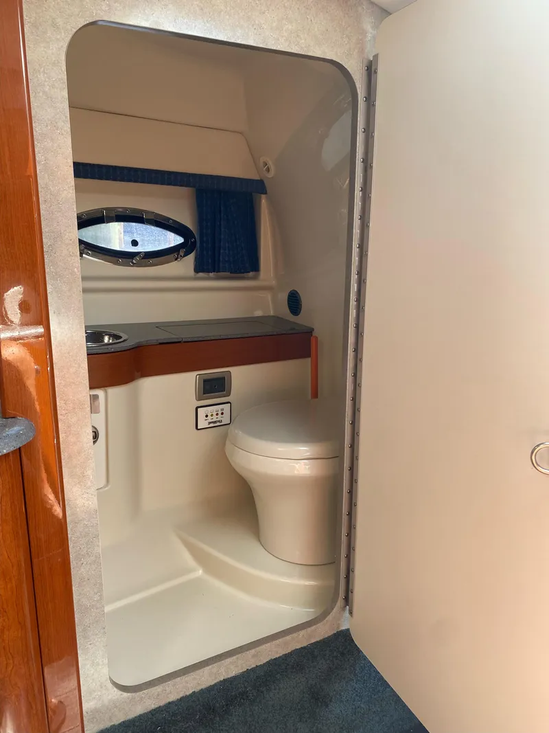 Slide: The Image of 2008 Formula 310 Sun Sport boat bathroom with toilet and sink. - 17