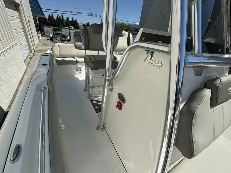 Slide: The Image of 2024 Key West 219 FS boat interior with seating and console. - 9