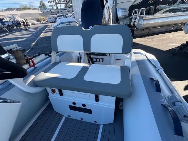 Slide: The Image of 2024 Highfield CL340 FCT boat interior with seating and control panel. - 6