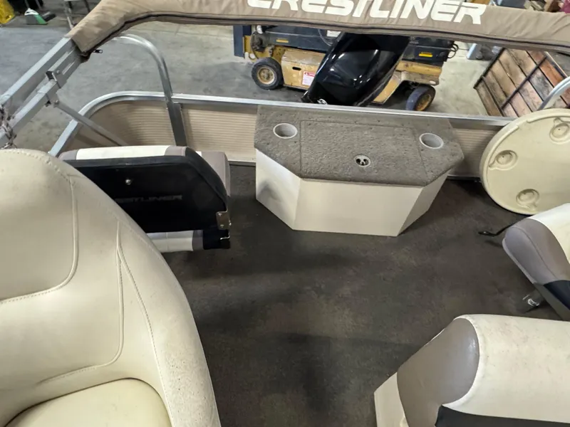 Slide: The Image of Interior of 2010 Crestliner Batata Bay 2185 boat with seating and storage. - 10