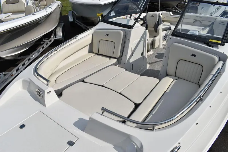 Slide: The Image of 2024 Stingray 201DC boat with spacious seating and sleek design. - 14