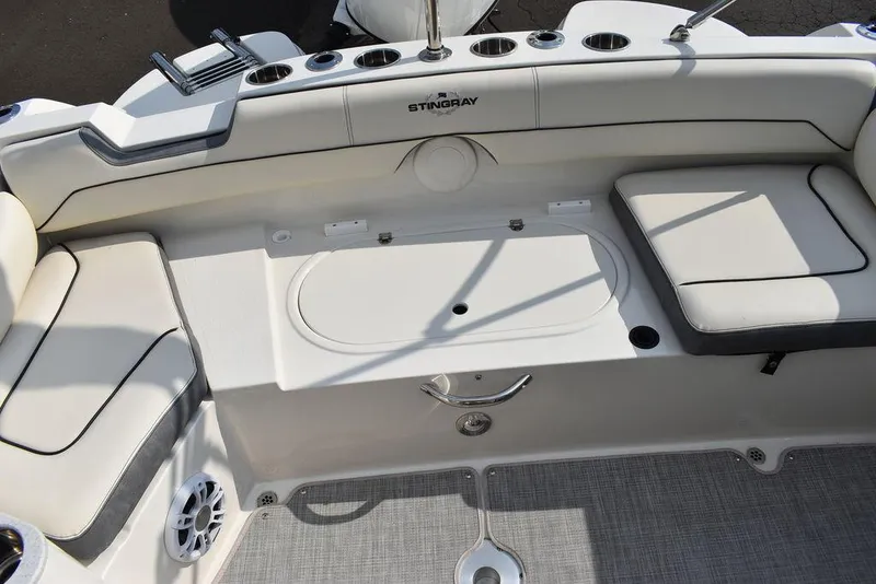 Slide: The Image of 2024 Stingray 201DC boat interior with seating and storage compartments. - 19