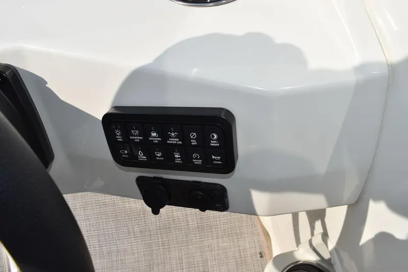 Slide: The Image of Control panel of 2024 Stingray 201DC boat, featuring various function buttons. - 39