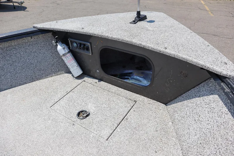 Slide: The Image of 2023 Polar Kraft Outlander 2010 CC boat interior storage compartment. - 13