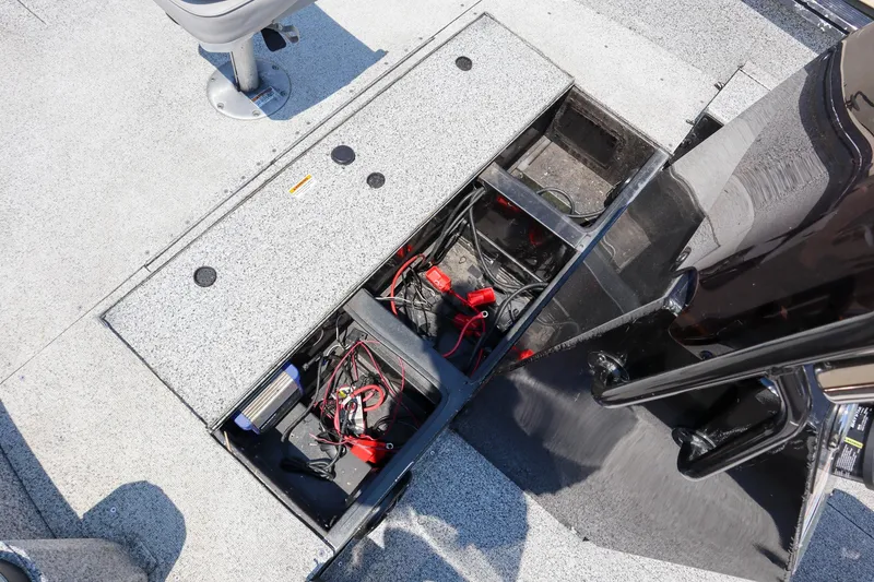 Slide: The Image of Open battery compartment of 2023 Polar Kraft Outlander 2010 CC boat. - 15