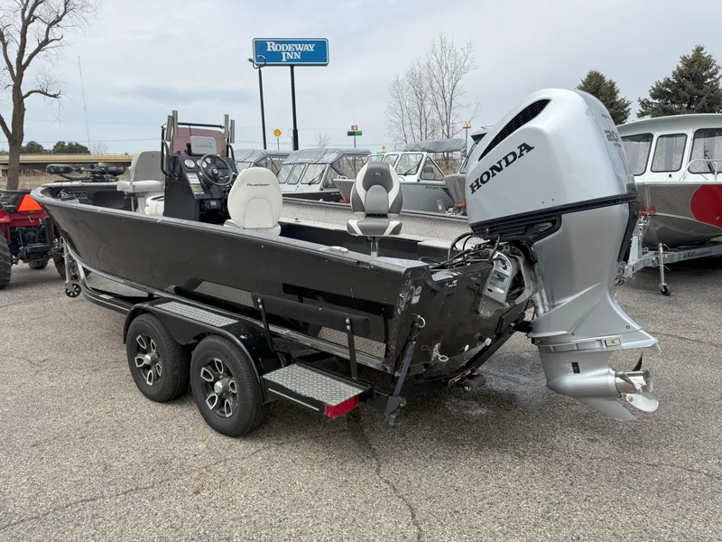 Slide: The Image of 2023 Polar Kraft Outlander 2010 CC boat with Honda engine on trailer. - 3