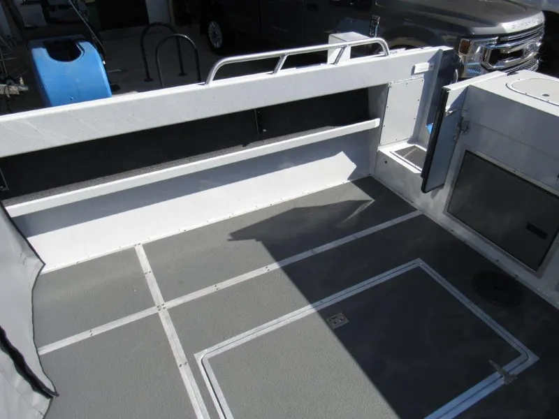 Slide: The Image of Interior view of 2024 North River 23 SEAHAWK RTF boat showing spacious deck and storage compartments. - 10