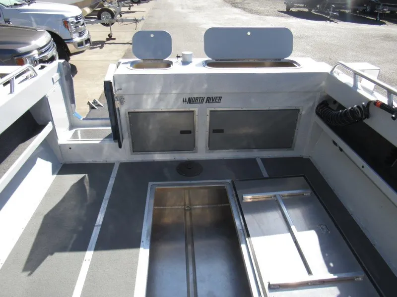 Slide: The Image of Interior view of 2024 North River 23 SEAHAWK RTF boat showing storage compartments. - 11