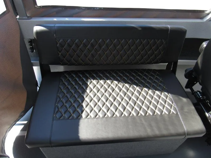 Slide: The Image of 2024 North River 23 SEAHAWK RTF boat interior with diamond-stitched black leather seating. - 14