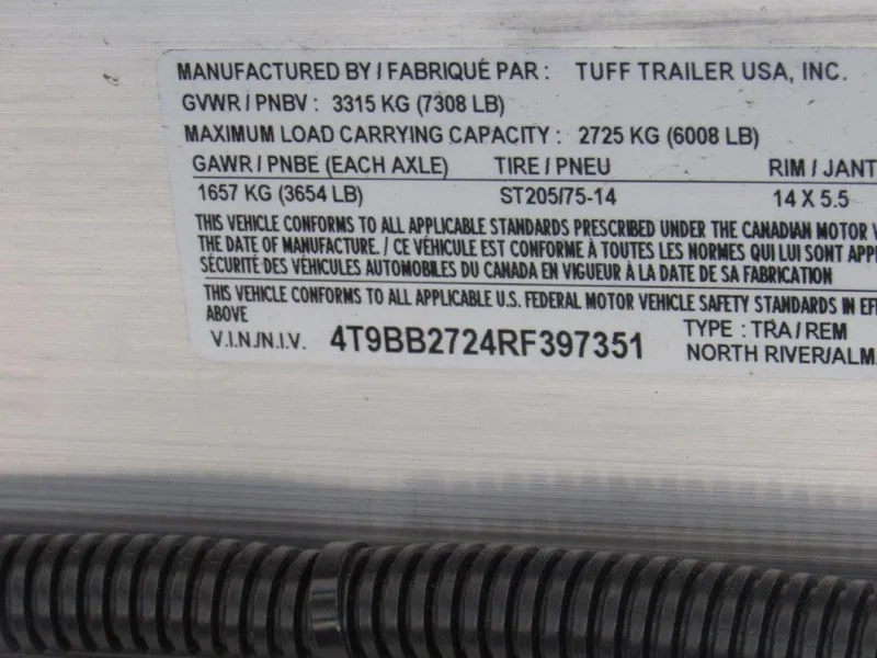 Slide: The Image of 2024 North River 23 SEAHAWK RTF trailer specifications label with VIN and load capacities. - 18