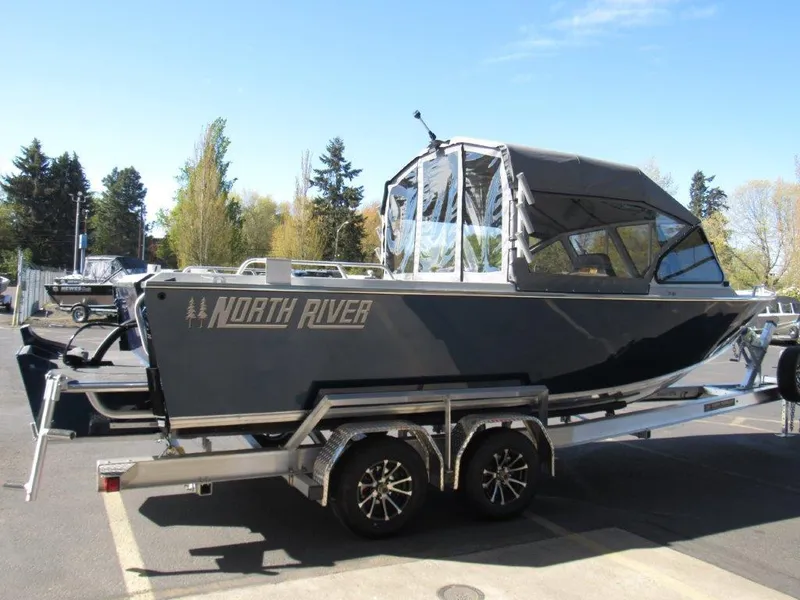 Slide: The Image of 2024 North River 23 SEAHAWK RTF boat on a trailer in a parking lot. - 5