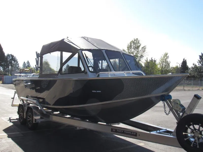 Slide: The Image of 2024 North River 23 SEAHAWK RTF boat on a trailer in a parking lot. - 7